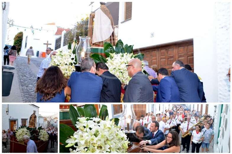 Momento en que los políticos empujan el trono del santo por la calle de Carreñas (Foto TA)